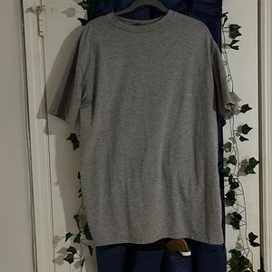 A regular all grey t shirt with the word baby girl in the back all pink